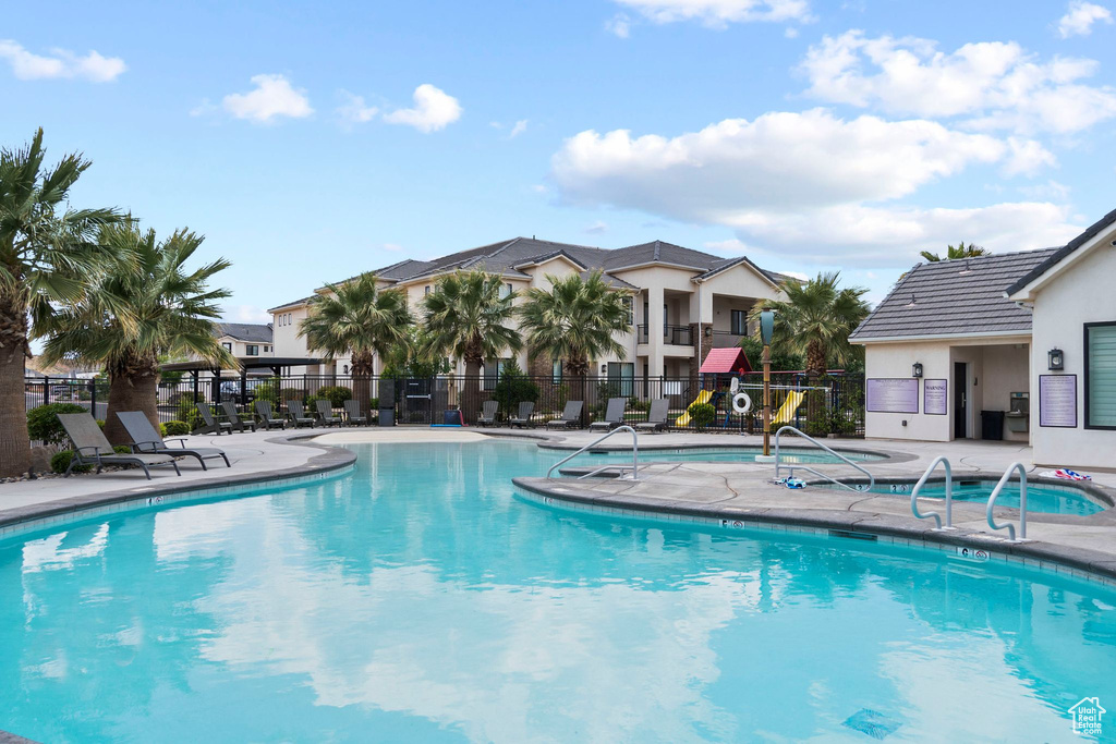 Community pool featuring a patio