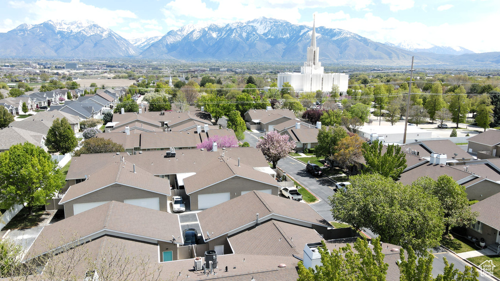 Aerial perspective of suburban area featuring a mountain backdrop