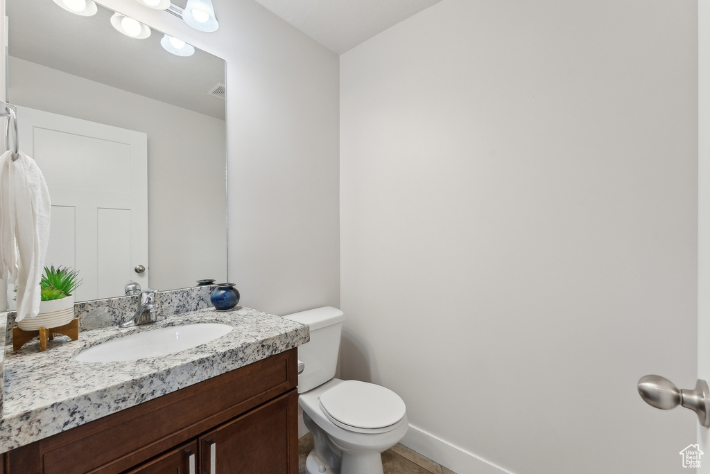 Bathroom featuring toilet and vanity