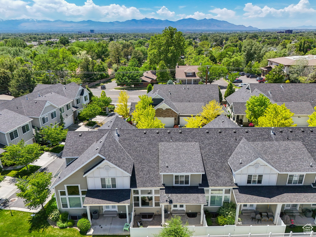 Aerial view of residential area featuring a mountainous background