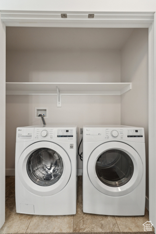 Laundry area with washing machine and clothes dryer