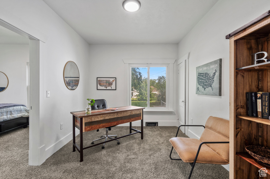Home office featuring carpet floors and baseboards
