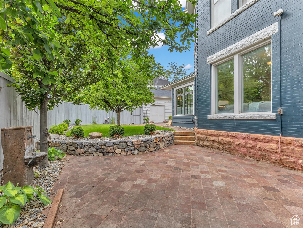 Fenced backyard with a patio