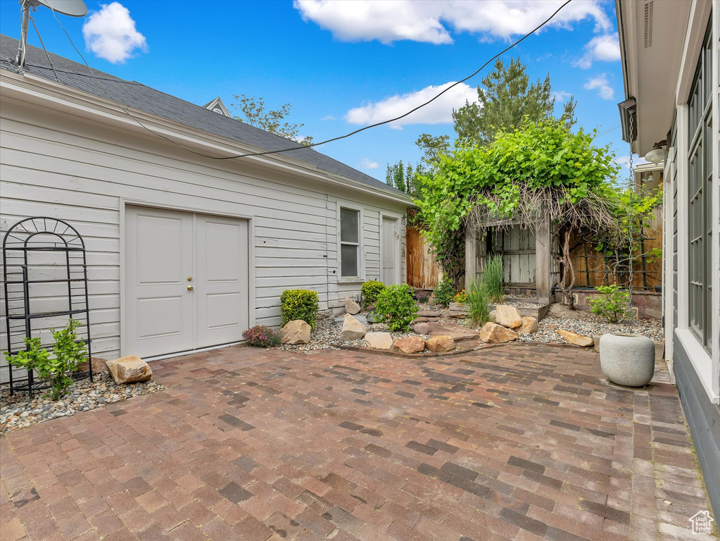 Fenced backyard with a patio