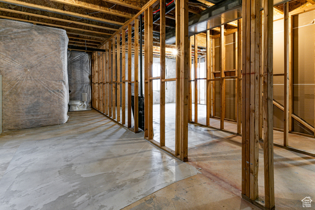 Miscellaneous room with unfinished concrete flooring