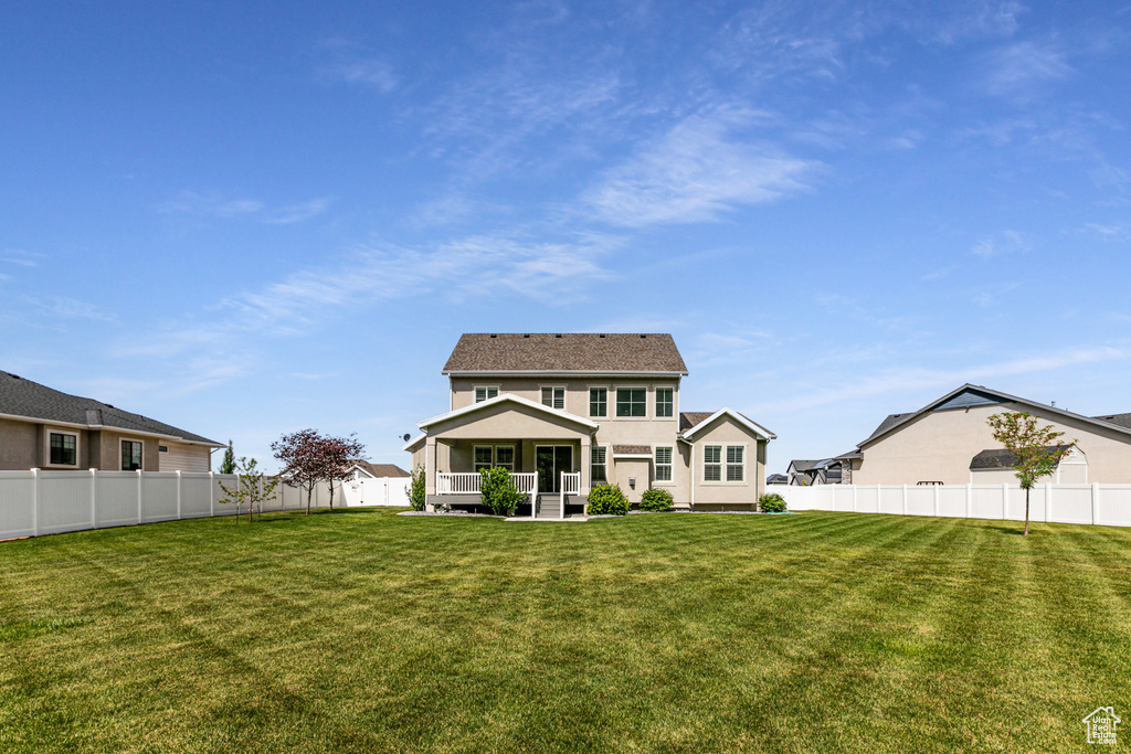 Rear view of property featuring stucco siding