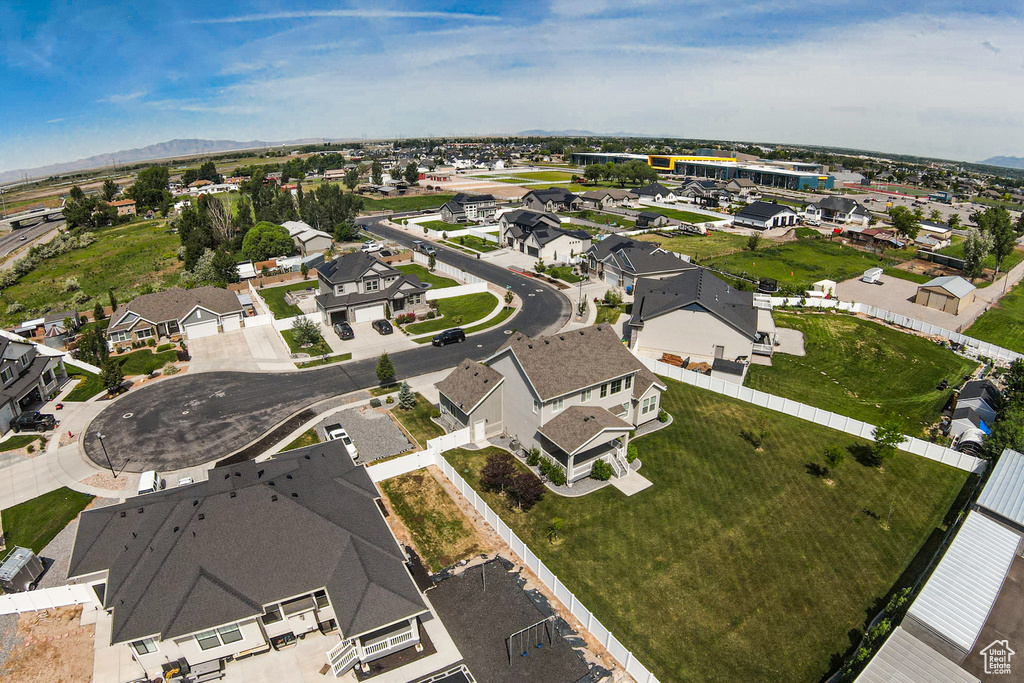 Aerial view of property\'s location with nearby suburban area and mountains