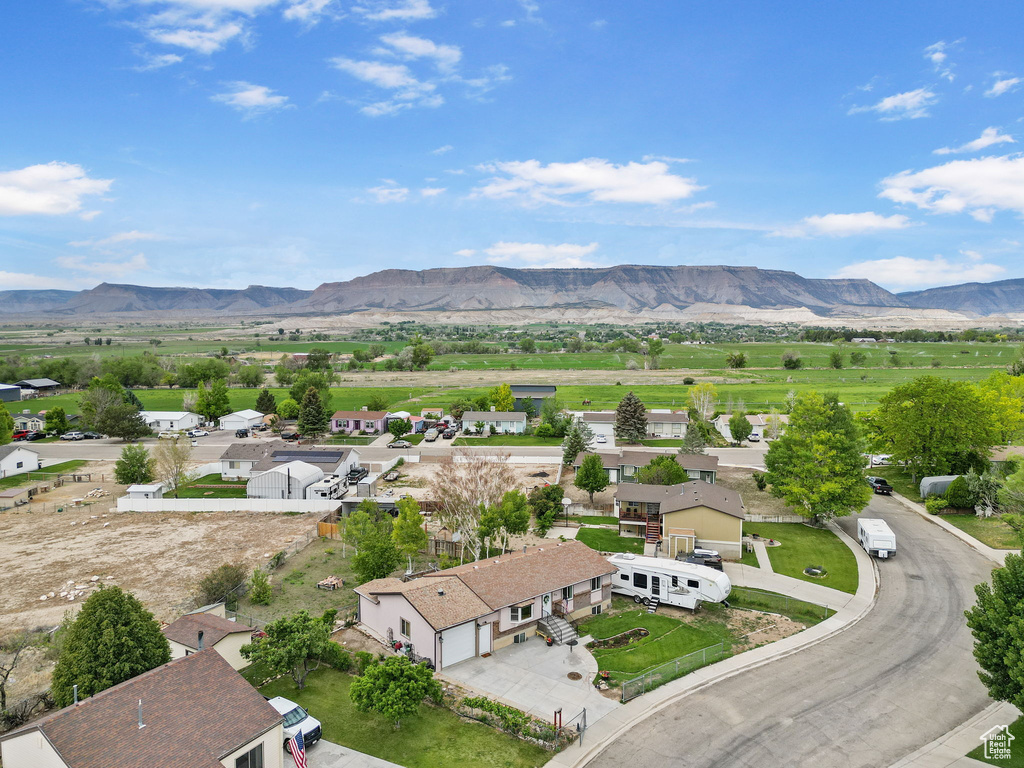 Aerial view of residential area with a mountain backdrop