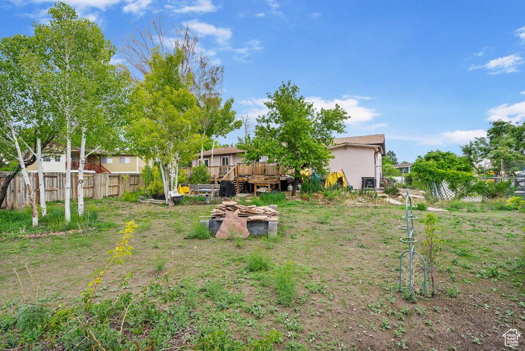 View of yard featuring a wooden deck