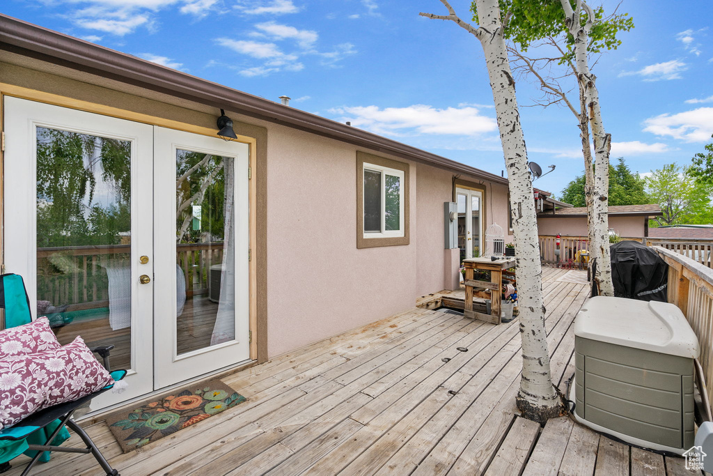 Deck with french doors and a grill