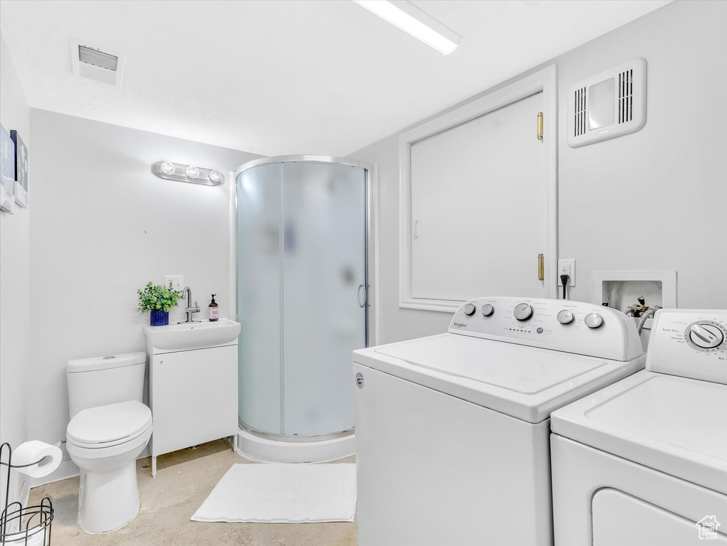 Laundry room featuring independent washer and dryer