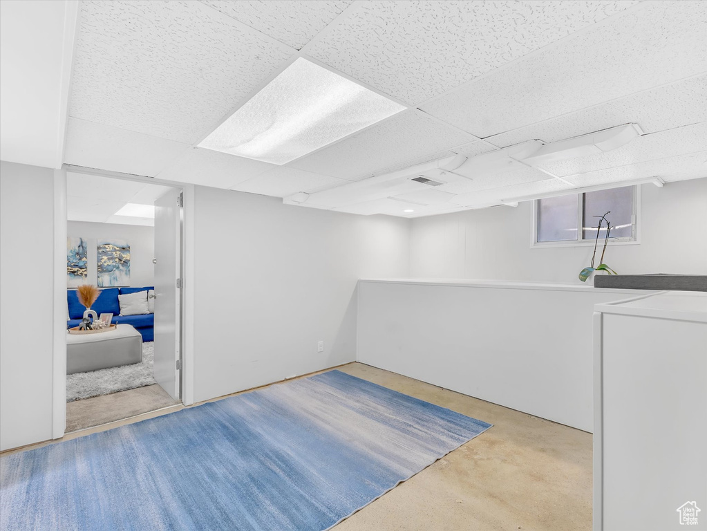 Below grade area featuring a paneled ceiling
