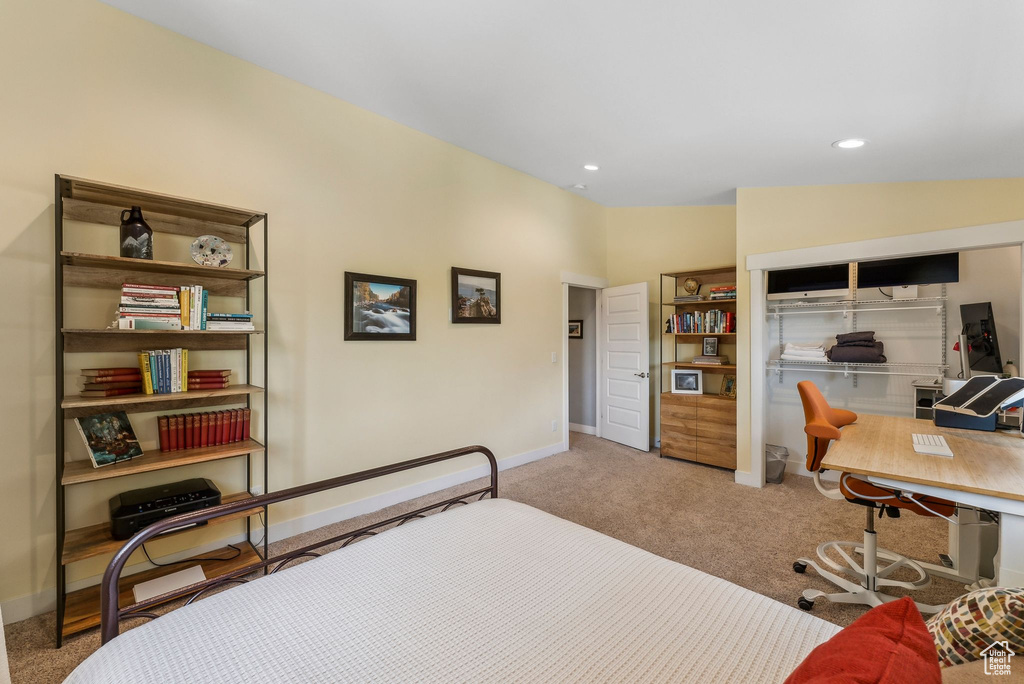 Carpeted bedroom with baseboards, a desk, and recessed lighting