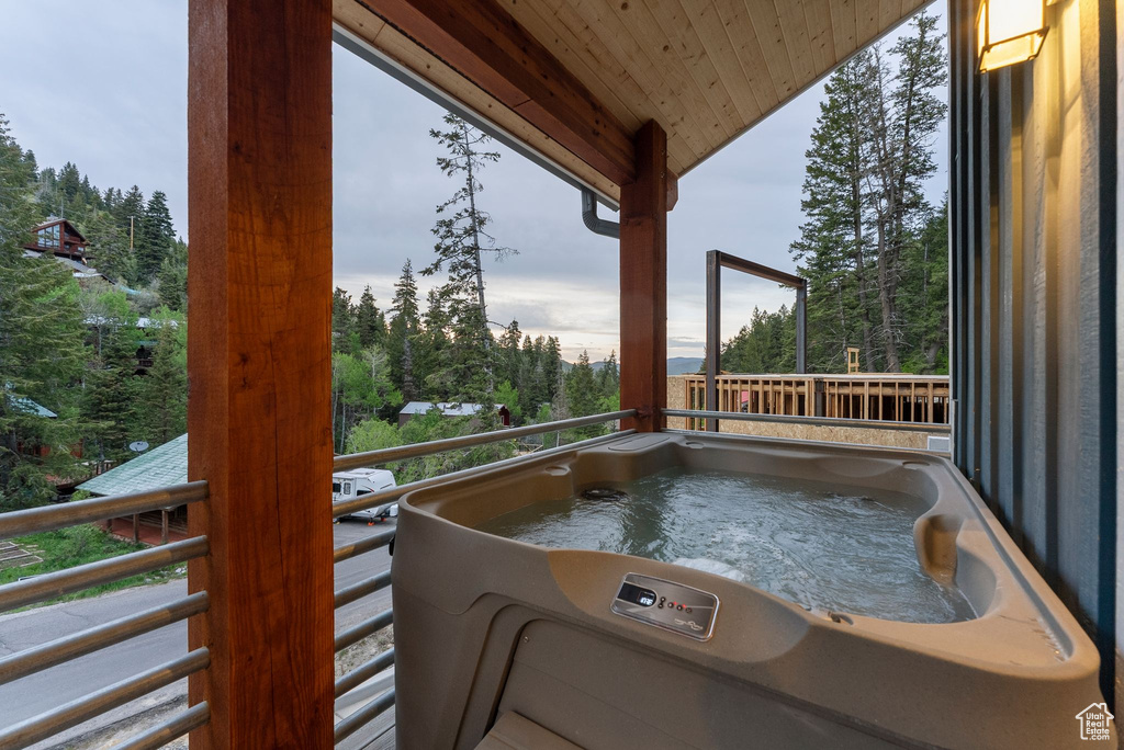View of patio / terrace with view of wooded area