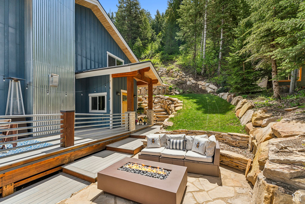 View of patio / terrace featuring an outdoor living space with a fire pit