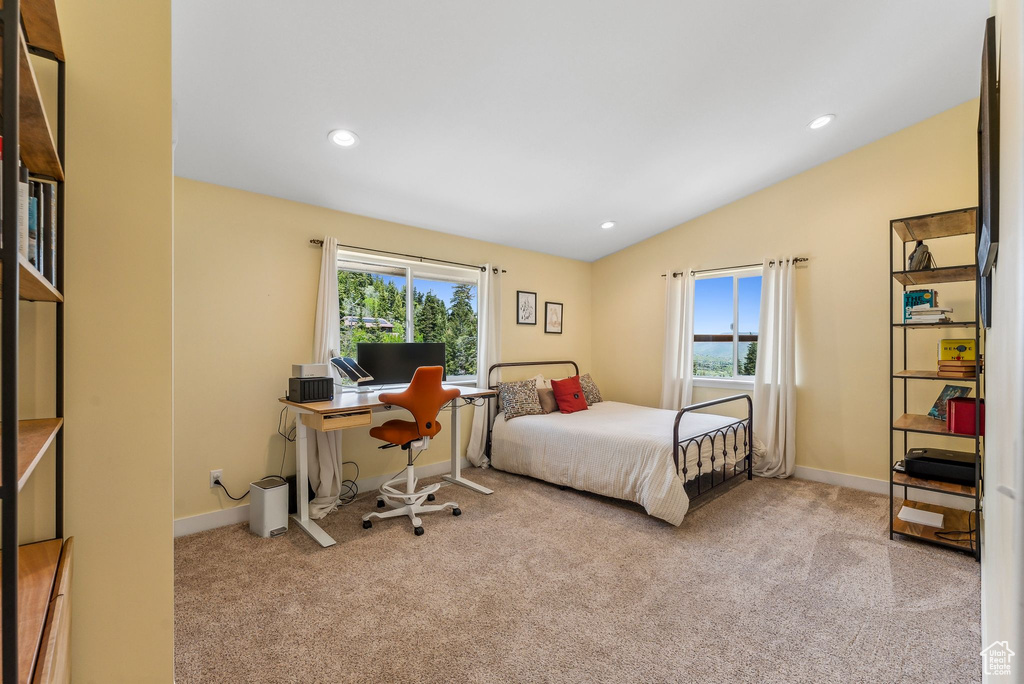 Bedroom with multiple windows, carpet flooring, vaulted ceiling, baseboards, and recessed lighting
