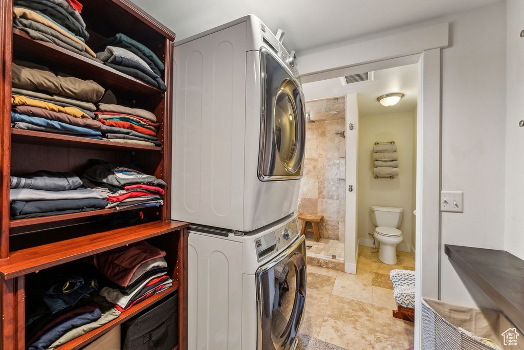 Washroom with stacked washing machine and dryer
