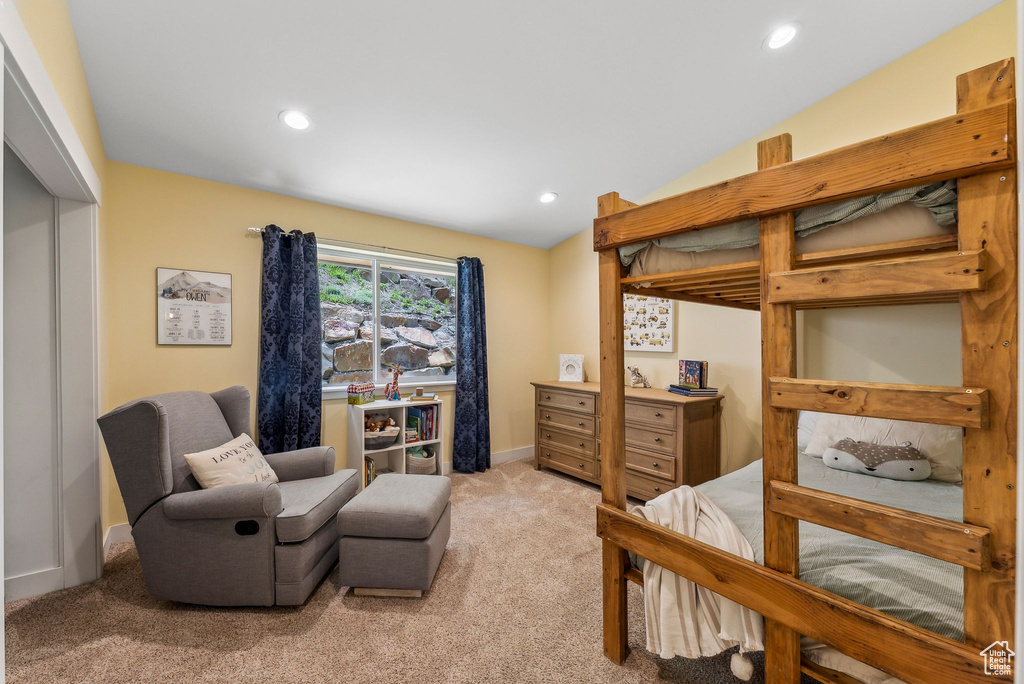 Bedroom with light carpet, recessed lighting, and baseboards