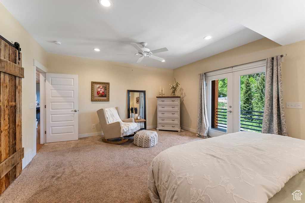 Carpeted bedroom with access to exterior, recessed lighting, baseboards, a barn door, and a ceiling fan