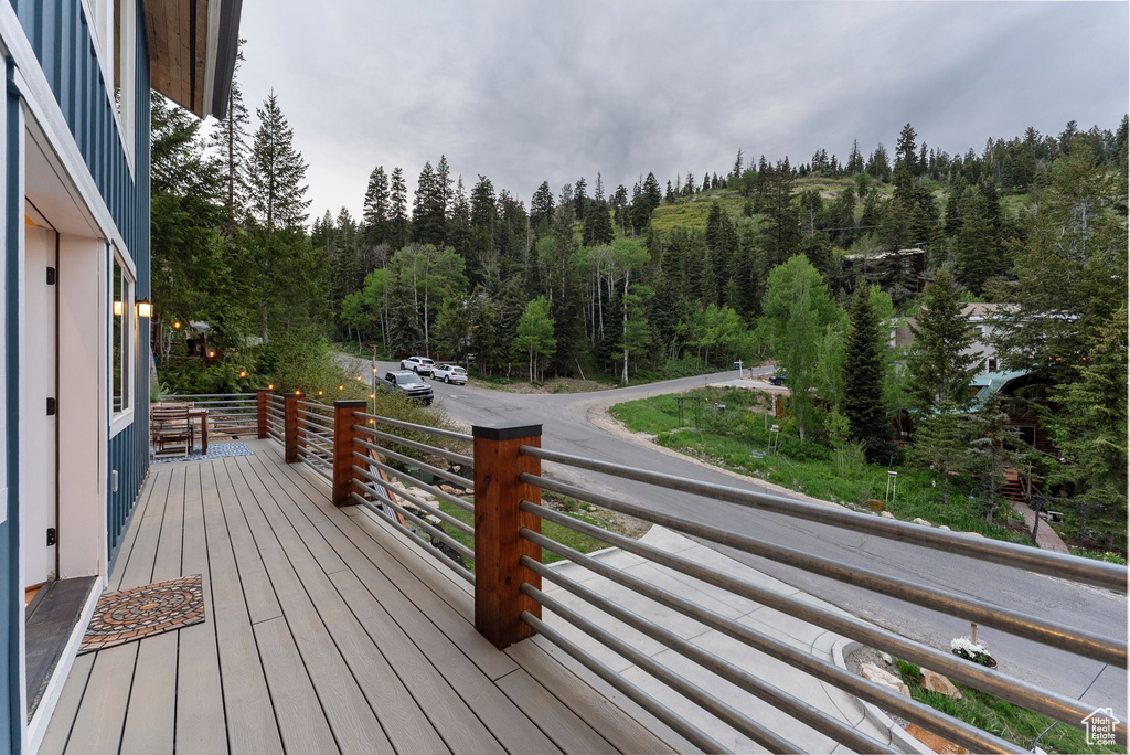 Wooden terrace with a wooded view