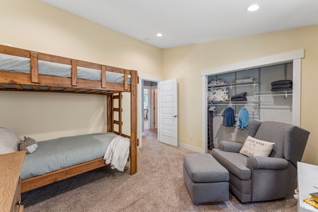 Bedroom featuring a closet, carpet, recessed lighting, and baseboards
