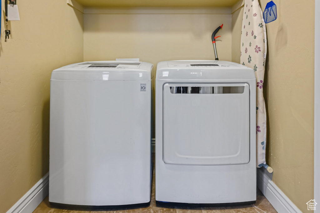 Laundry room featuring washing machine and clothes dryer