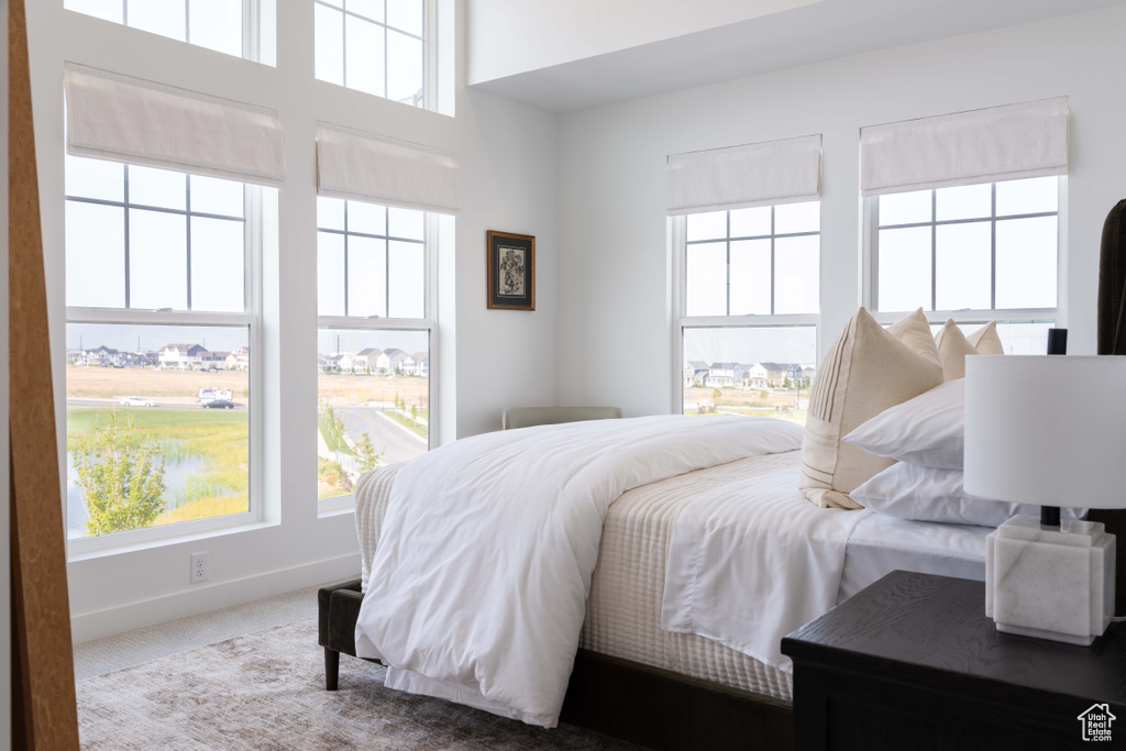 Carpeted bedroom with baseboards