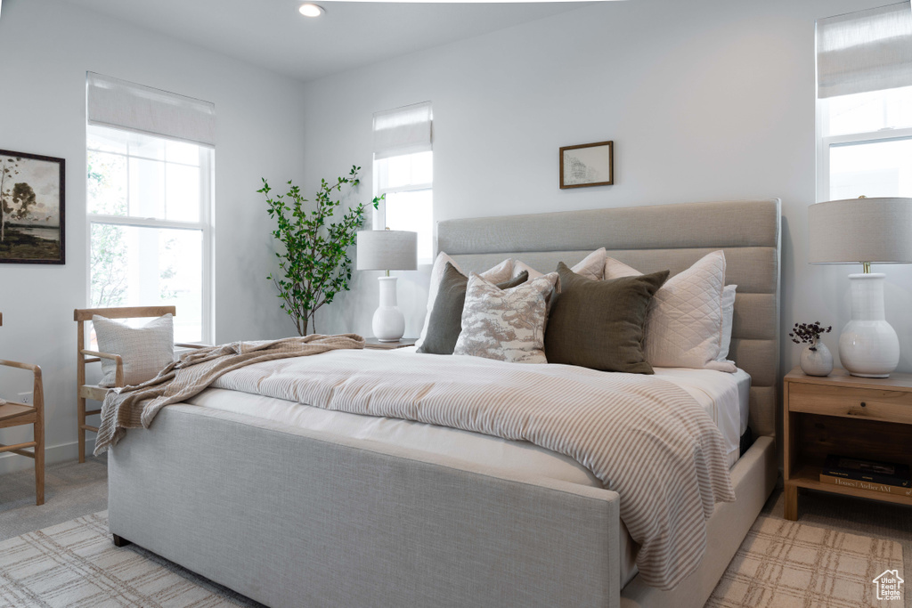 Bedroom with multiple windows and recessed lighting