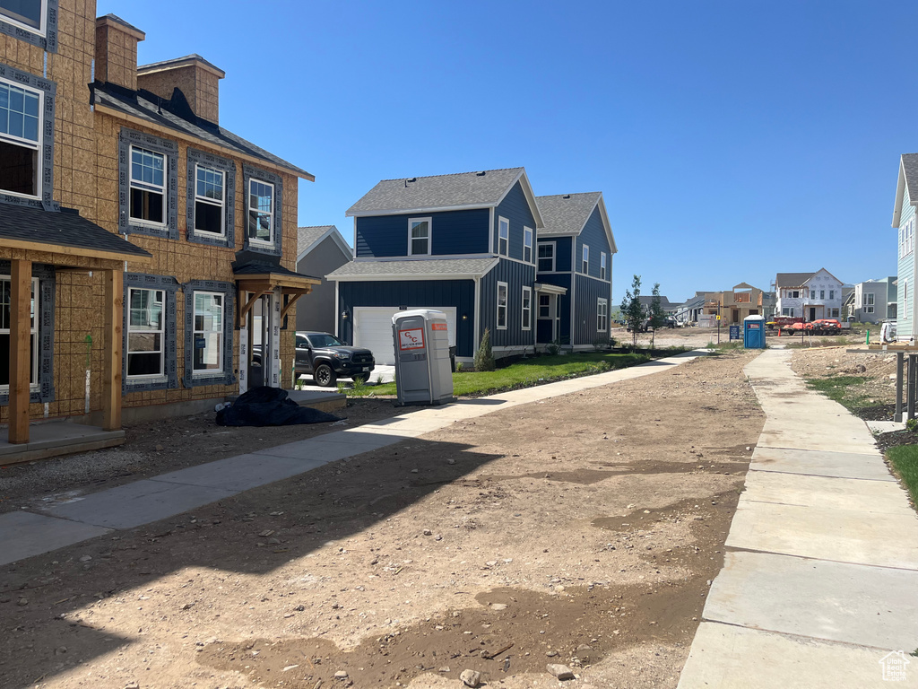 View of road with a residential view and sidewalks