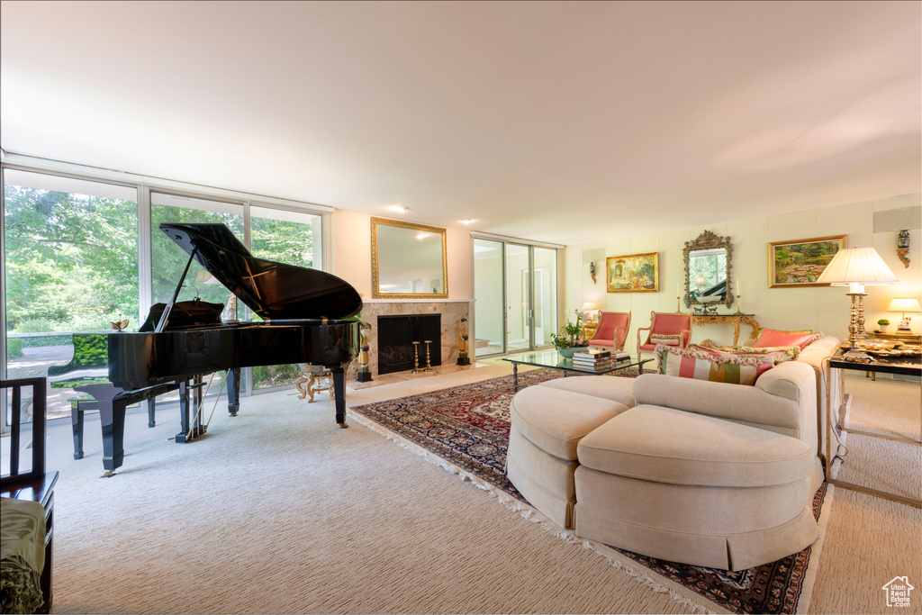 Carpeted living room featuring a fireplace