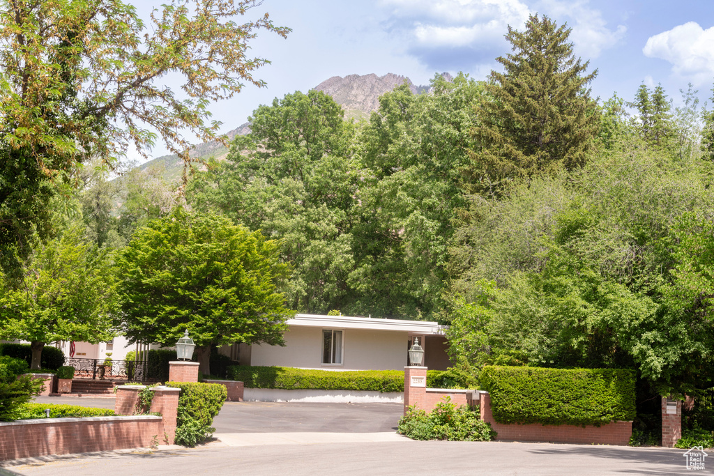 View of front of home featuring a mountain view and stucco siding