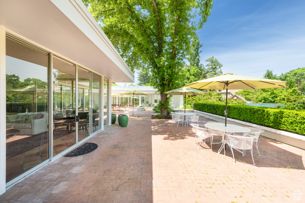 View of patio with outdoor dining area
