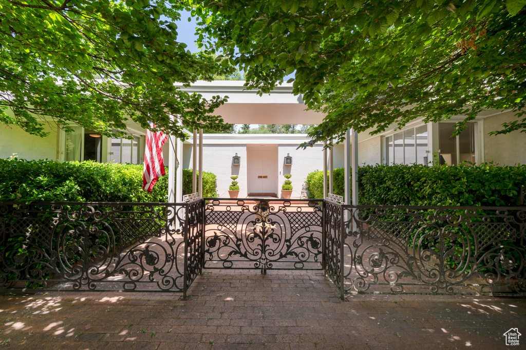 View of front facade featuring a fenced front yard and a gate