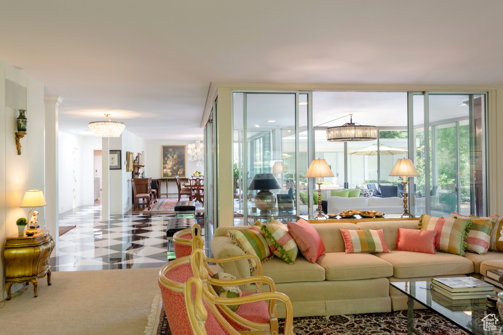 Living area featuring tile patterned floors and a chandelier