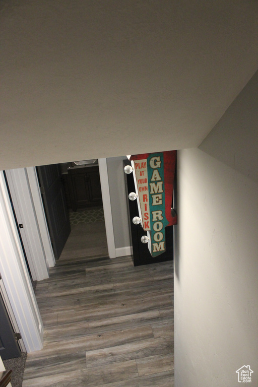 Hall with dark wood-style flooring