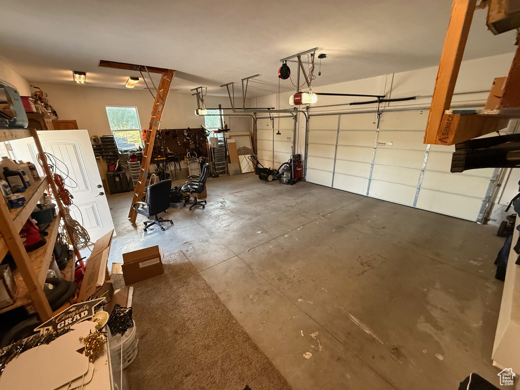 Garage featuring a garage door opener