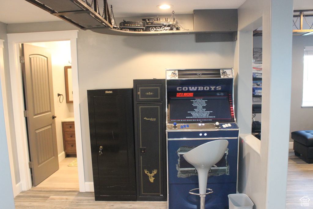 Bar area featuring light wood-style flooring