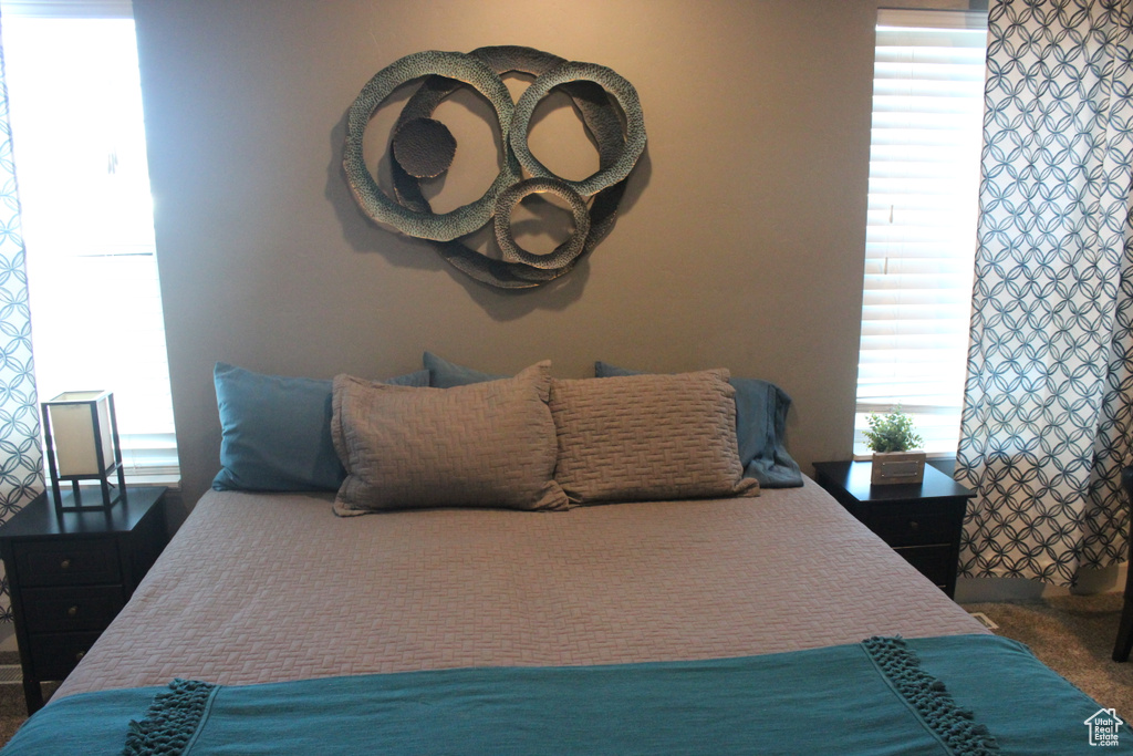 Bedroom featuring multiple windows