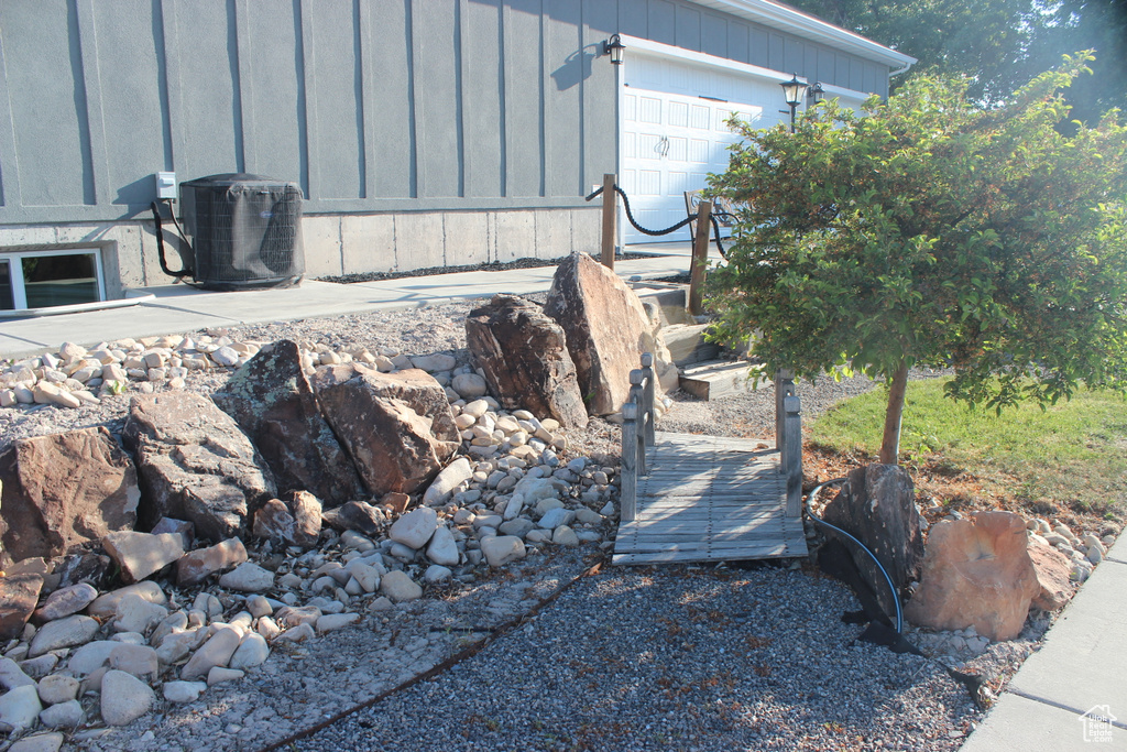 Exterior view of central AC and board and batten siding