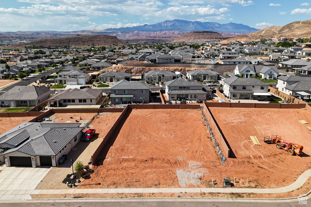 Aerial view of residential area featuring a mountainous background