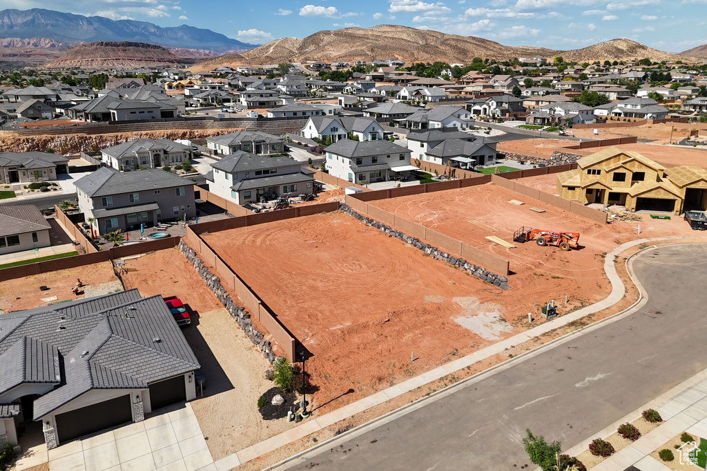 Aerial perspective of suburban area with a mountain backdrop