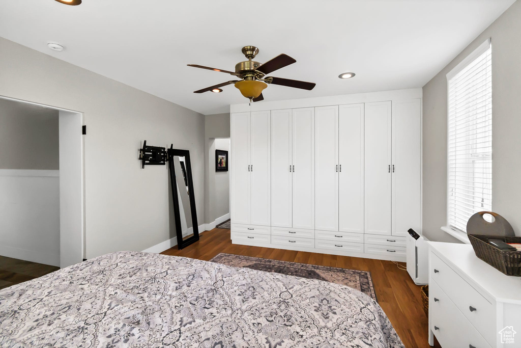 Bedroom with dark wood-style flooring, recessed lighting, and ceiling fan