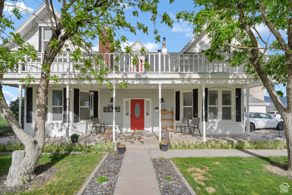 View of property with a porch