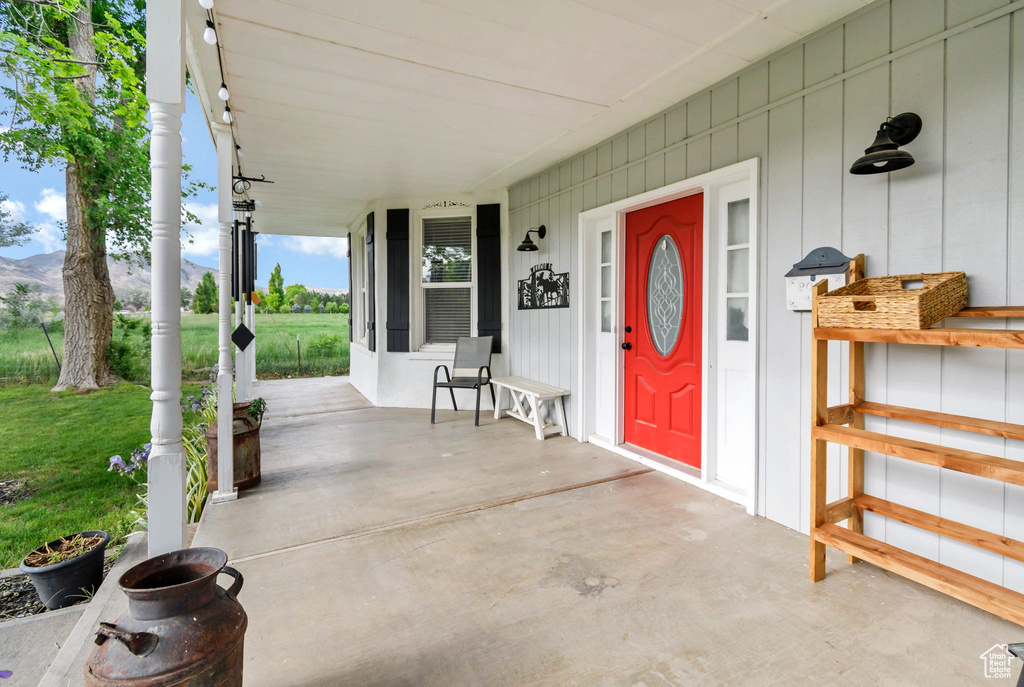 Property entrance featuring a porch and a mountain view