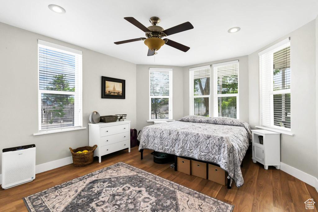Bedroom with baseboards, wood finished floors, recessed lighting, and a ceiling fan