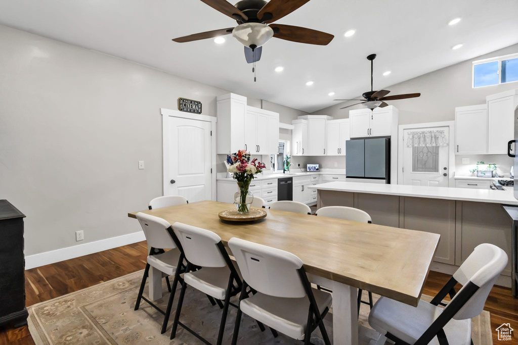 Dining area featuring a ceiling fan, dark wood finished floors, baseboards, recessed lighting, and high vaulted ceiling