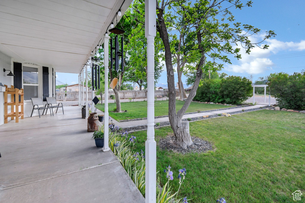 View of yard featuring covered porch
