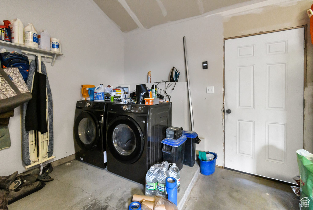 Washroom featuring washing machine and clothes dryer