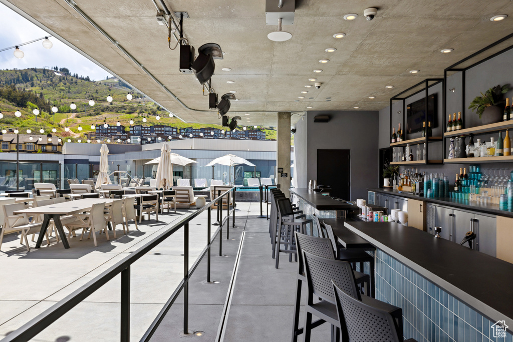 View of patio / terrace with an outdoor bar and a mountain view