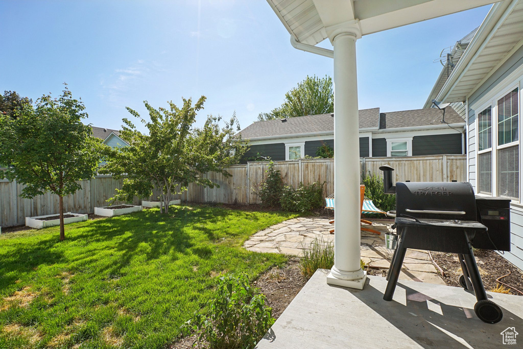 View of yard with a patio